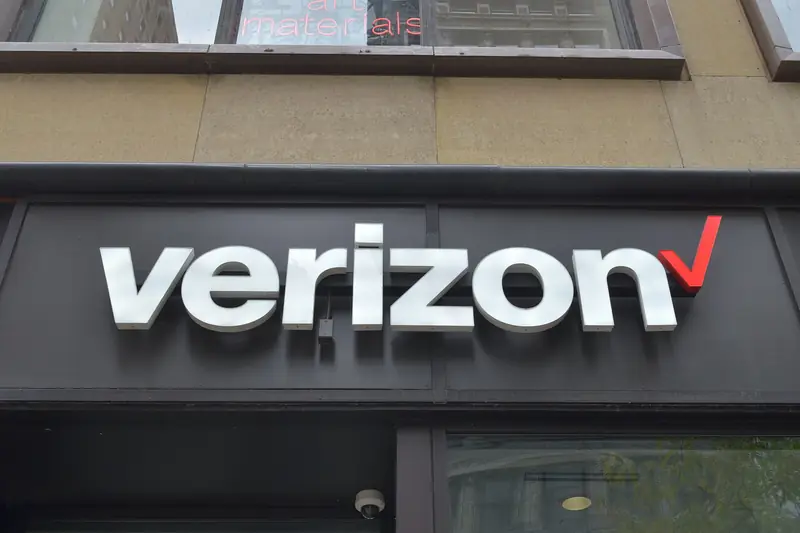 Verizon logo sign above a store entrance on State Street in downtown Chicago